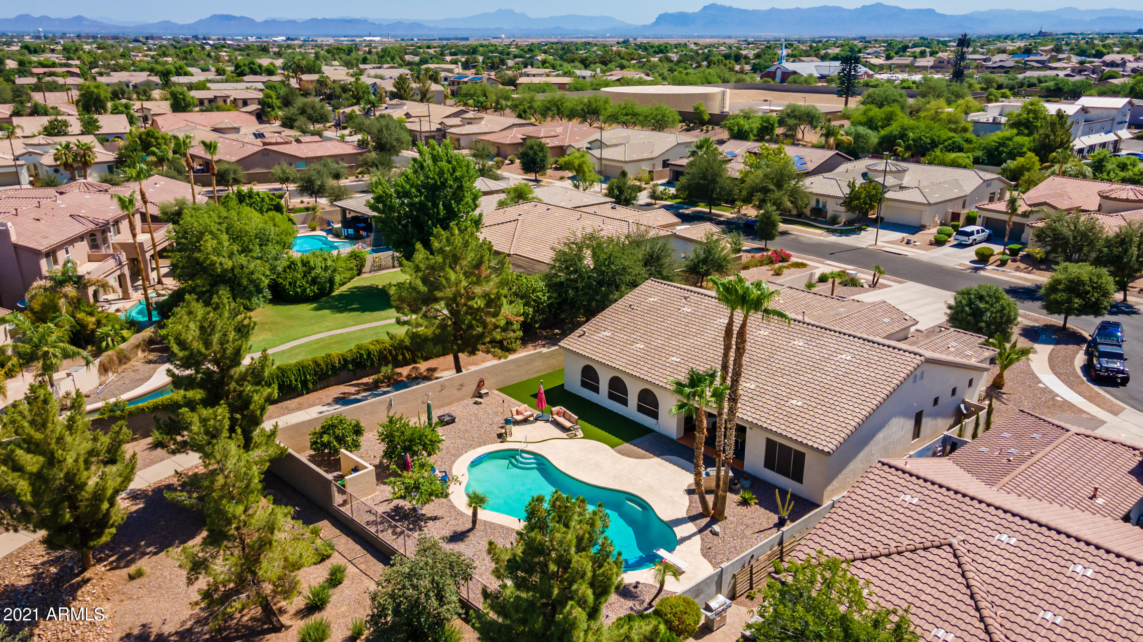 4648 South Ranger Court Gilbert, AZ 85297 - Photo 1 of 49 an aerial view of a house with a lake view