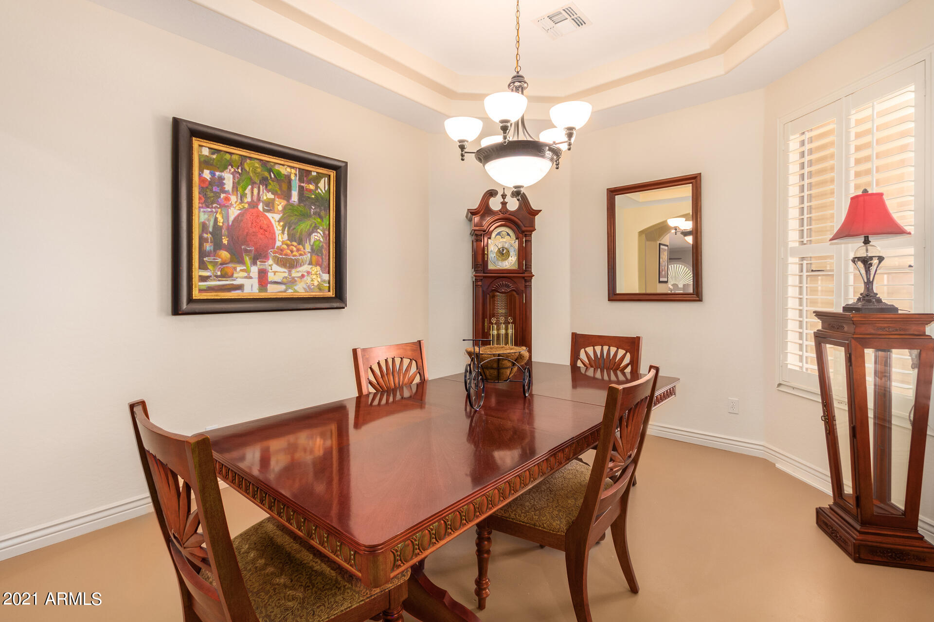 4648 South Ranger Court Gilbert, AZ 85297 - Photo 24 of 49 a dining room with furniture and chandelier