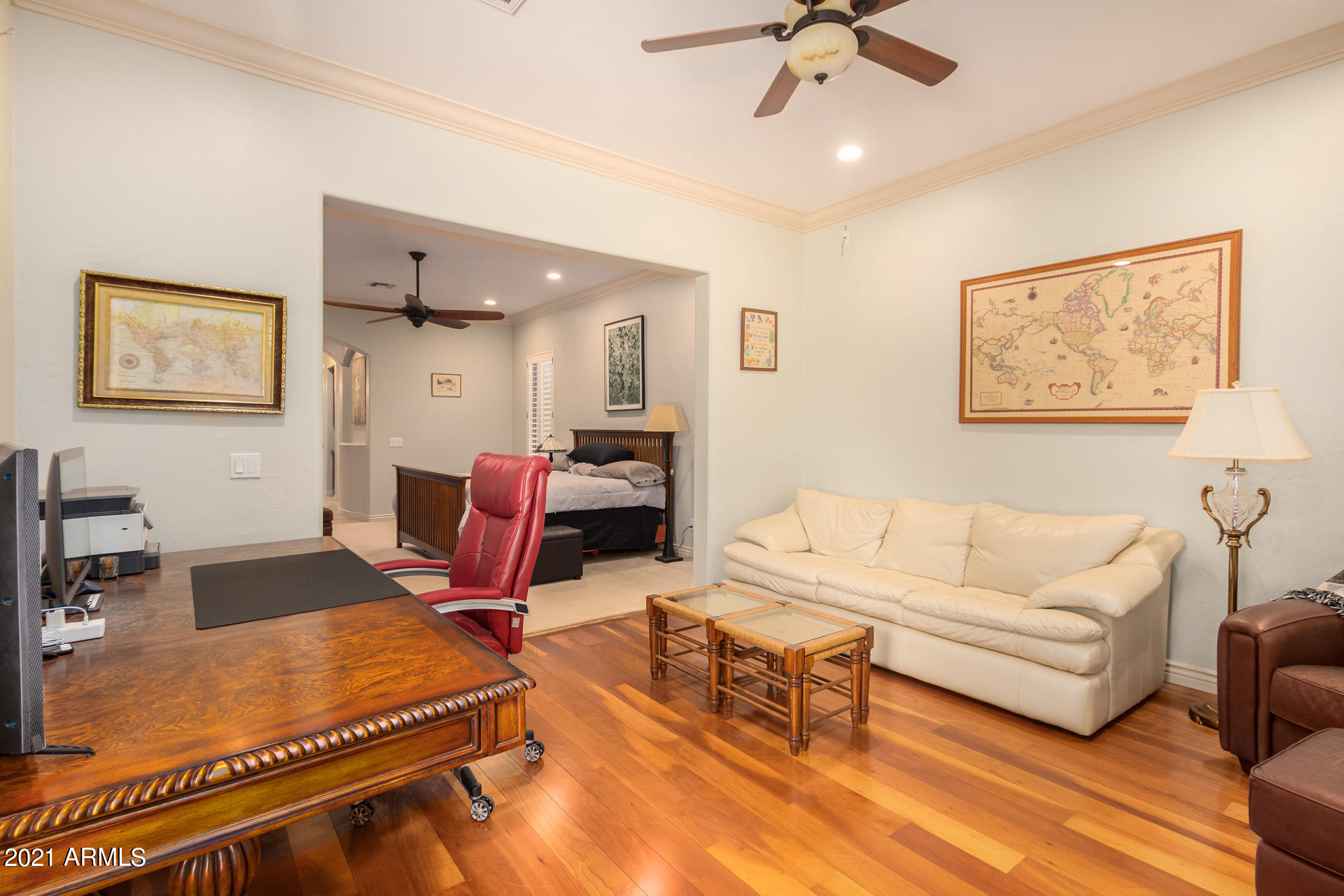 4648 South Ranger Court Gilbert, AZ 85297 - Photo 30 of 49 a living room with furniture gym equipment and a ceiling fan