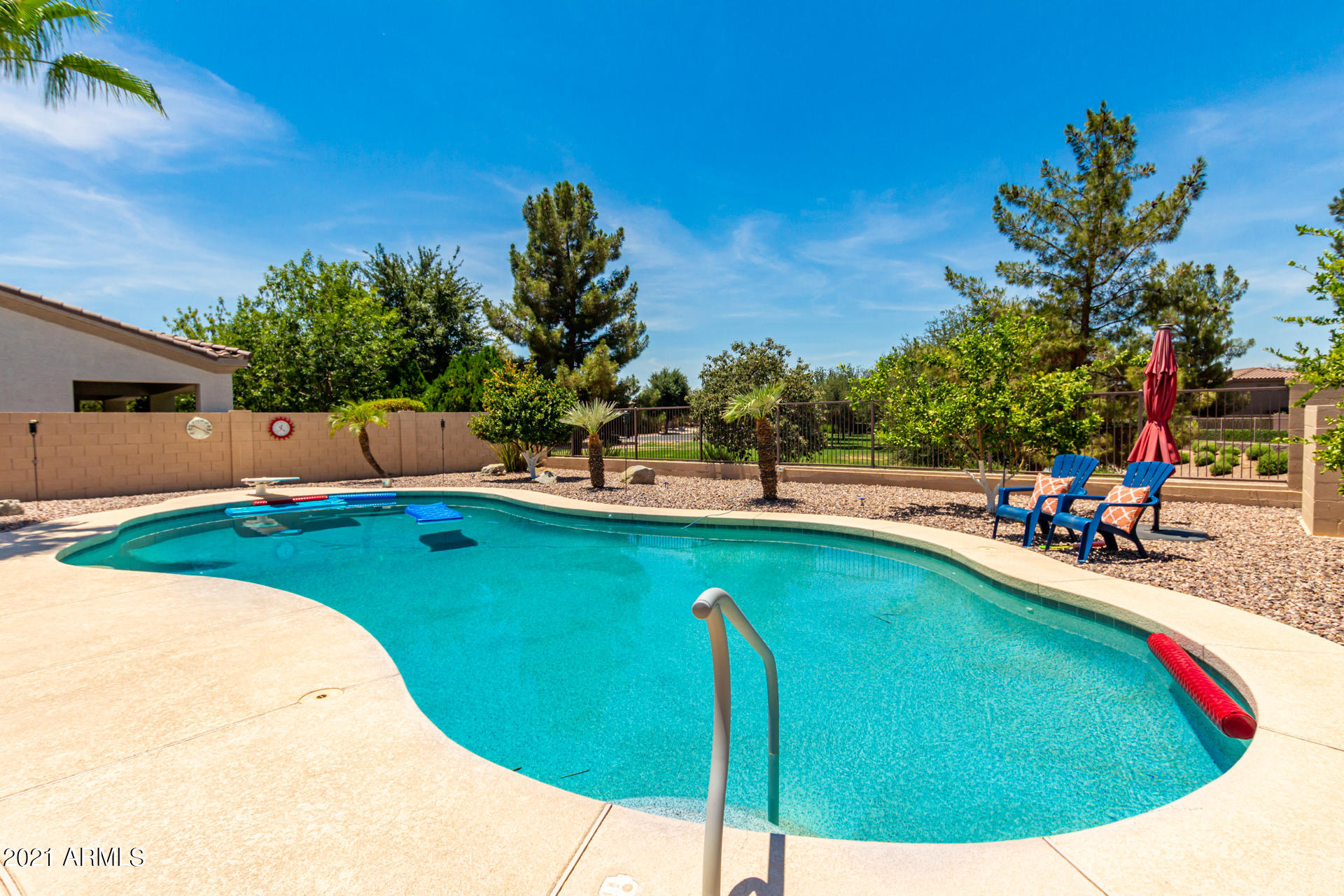 4648 South Ranger Court Gilbert, AZ 85297 - Photo 45 of 49 a view of a swimming pool with a patio