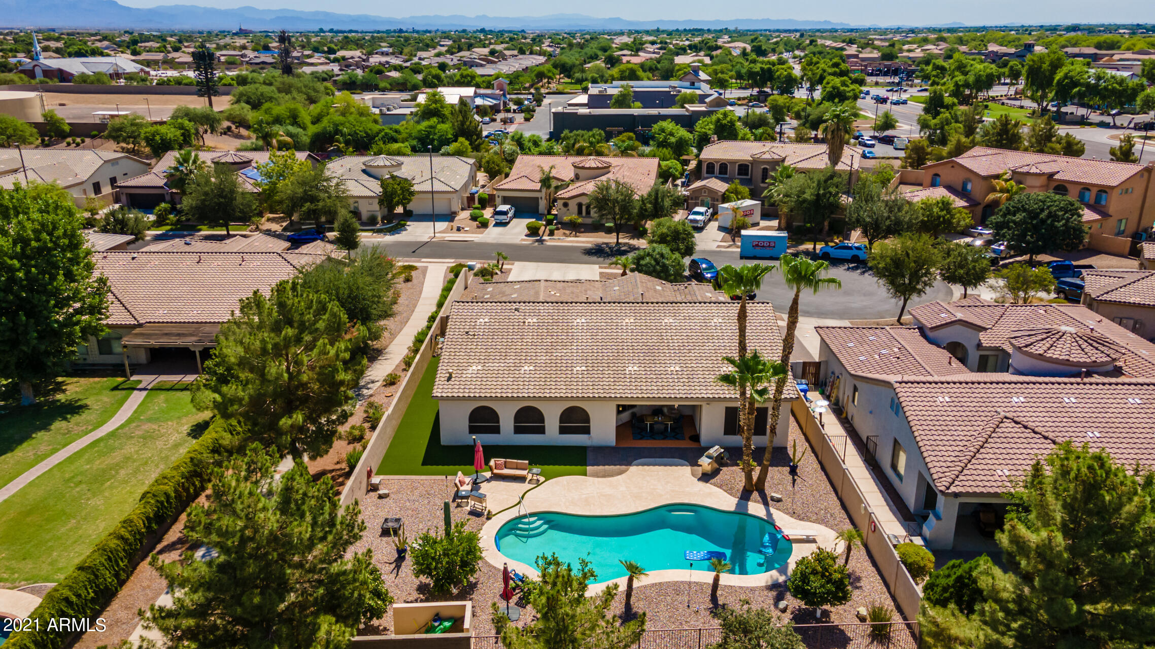 4648 South Ranger Court Gilbert, AZ 85297 - Photo 5 of 49 an aerial view of a house with a swimming pool yard and outdoor seating