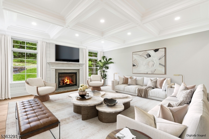 8 Cobblestone Court Warren, NJ 07059 - Photo 16 of 50 a living room with furniture a fireplace and a flat screen tv