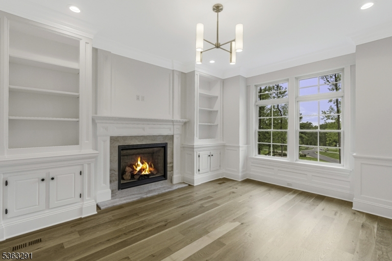 8 Cobblestone Court Warren, NJ 07059 - Photo 18 of 50 a view of an empty room with a fireplace and a window