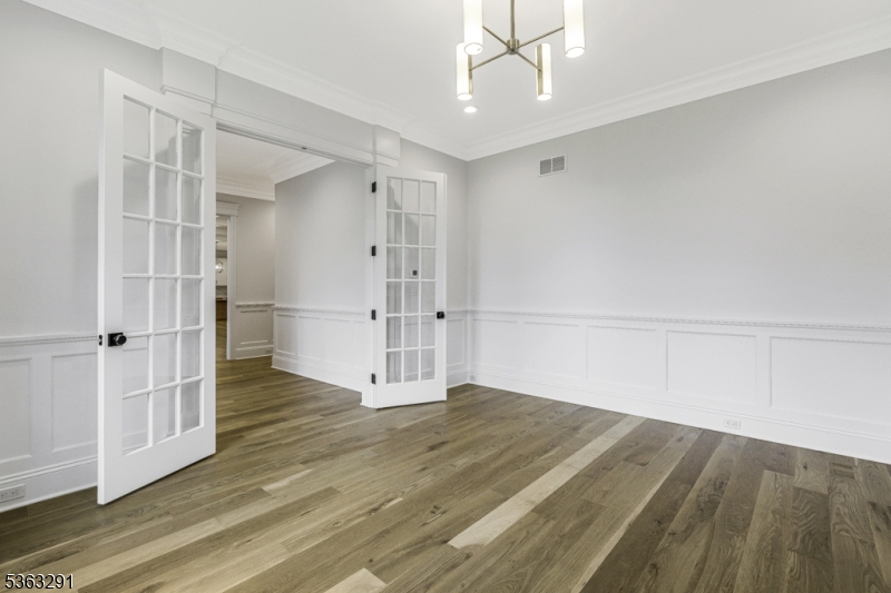 8 Cobblestone Court Warren, NJ 07059 - Photo 20 of 50 an empty room with wooden floor and windows