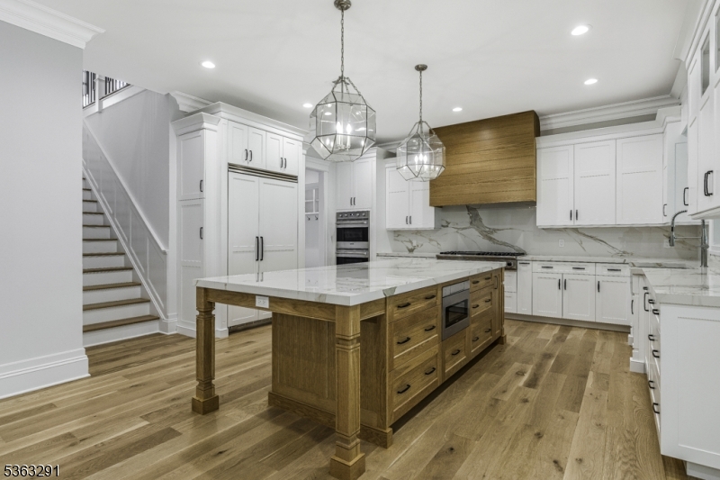 8 Cobblestone Court Warren, NJ 07059 - Photo 23 of 50 a kitchen with stainless steel appliances granite countertop a stove and a view of kitchen