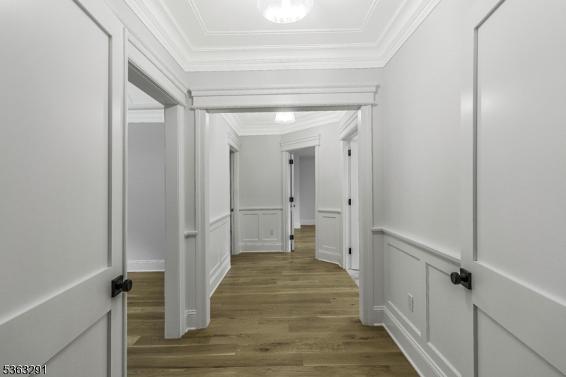 8 Cobblestone Court Warren, NJ 07059 - Photo 35 of 50 a view of a hallway with wooden floor and staircase