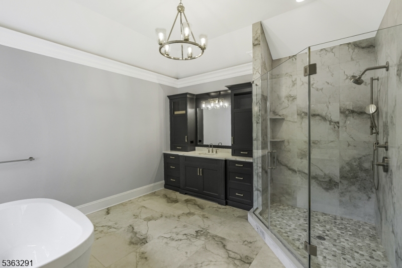 8 Cobblestone Court Warren, NJ 07059 - Photo 40 of 50 a bathroom with a tub shower sink and mirror