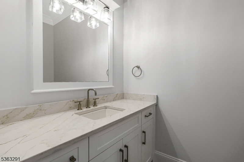 8 Cobblestone Court Warren, NJ 07059 - Photo 44 of 50 a bathroom with a sink vanity granite and a mirror