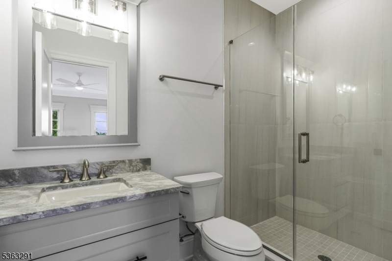 8 Cobblestone Court Warren, NJ 07059 - Photo 46 of 50 a bathroom with a granite countertop sink toilet and shower