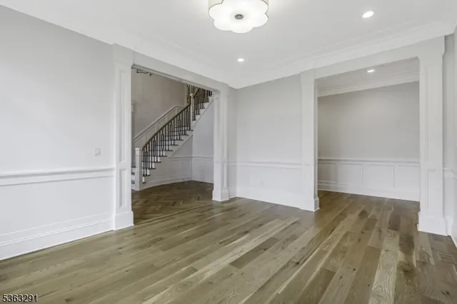 a view of empty room and wooden floor
