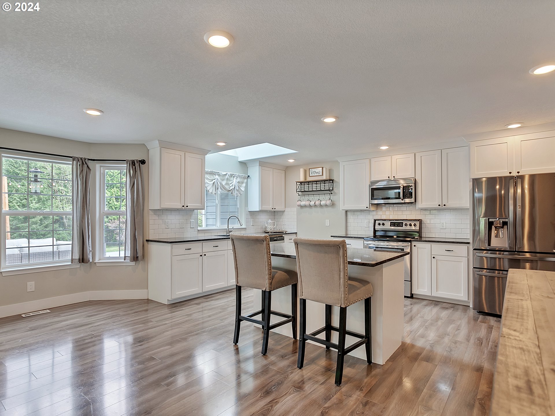 40209 Southeast Fish Hatchery Road Sandy, OR 97055 - Photo 9 of 48 a kitchen with refrigerator and wooden floor