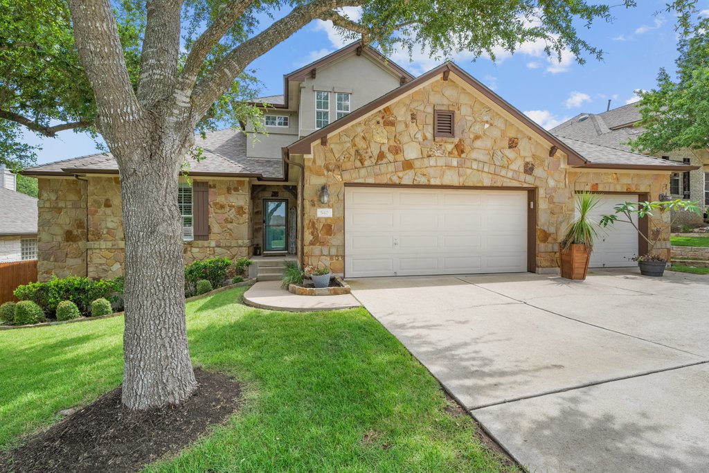 540 Manchester Lane Austin, TX 78737 - Photo 1 of 1 A striking stone facade and lush landscaping create an inviting welcome to this home.
