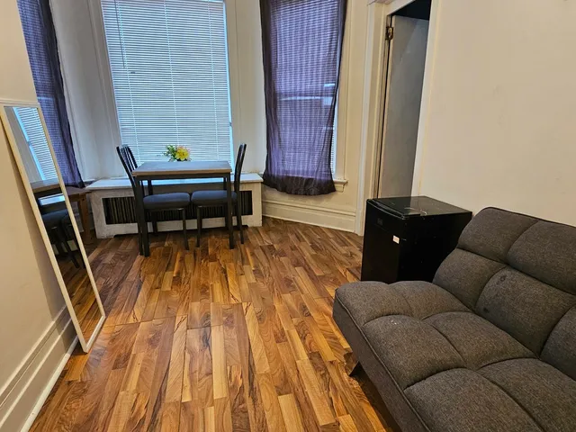 a living room with furniture and a rug
