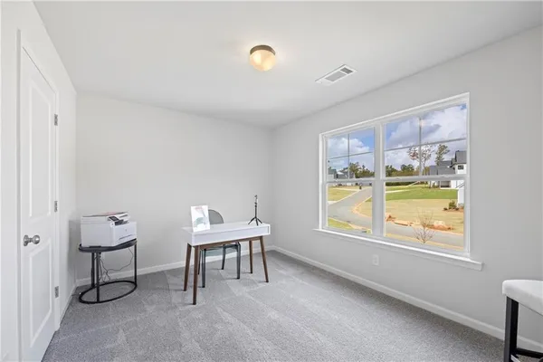 a workspace with furniture and window