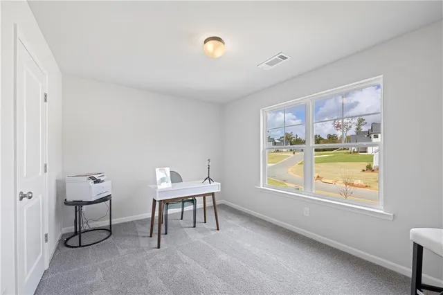 a workspace with furniture and window