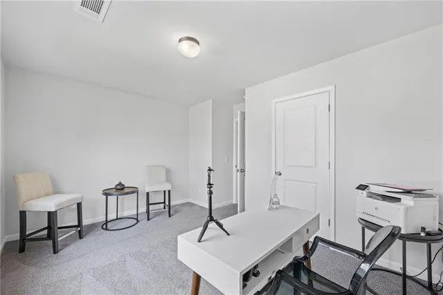 a view of a workspace with furniture