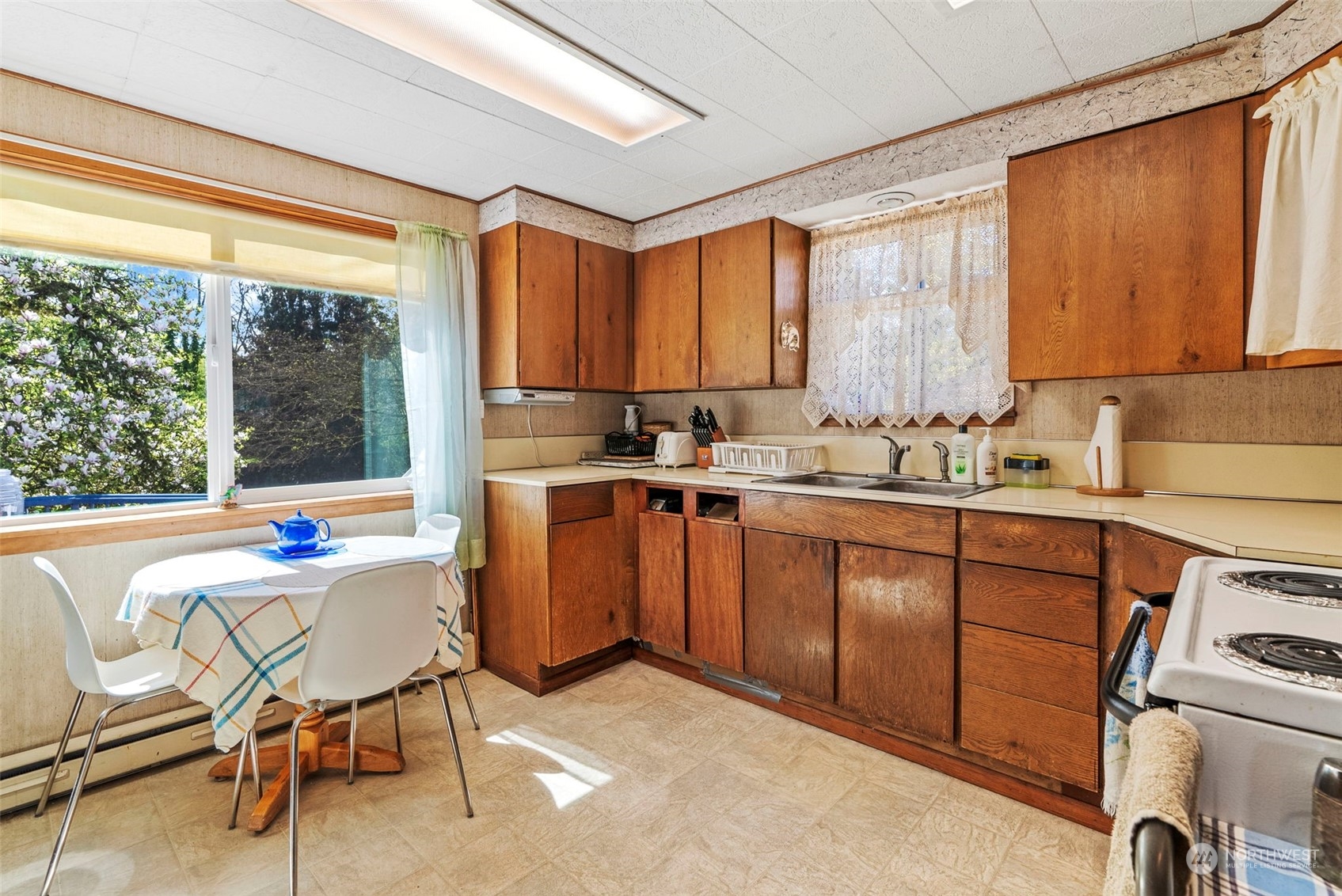 502 Burcham Street Kelso, WA 98626 - Photo 16 of 38 a kitchen with a window a sink and a refrigerator