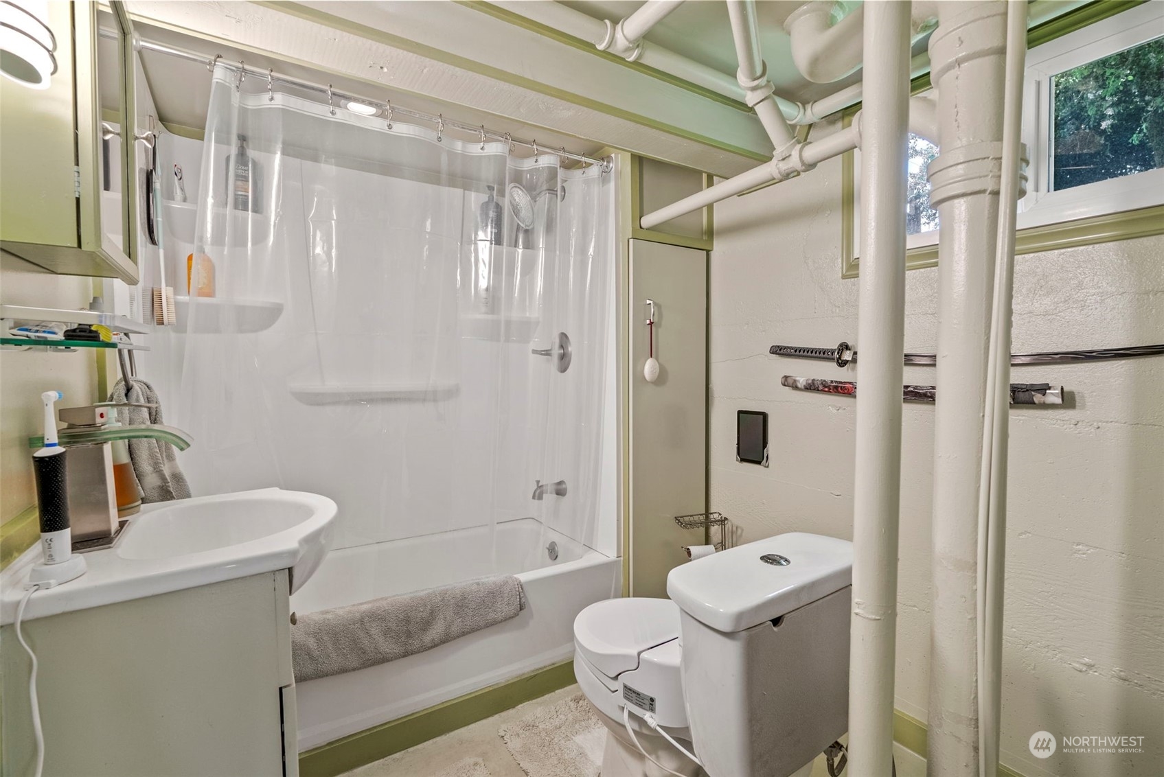 502 Burcham Street Kelso, WA 98626 - Photo 25 of 38 a bathroom with a granite countertop sink a toilet and shower