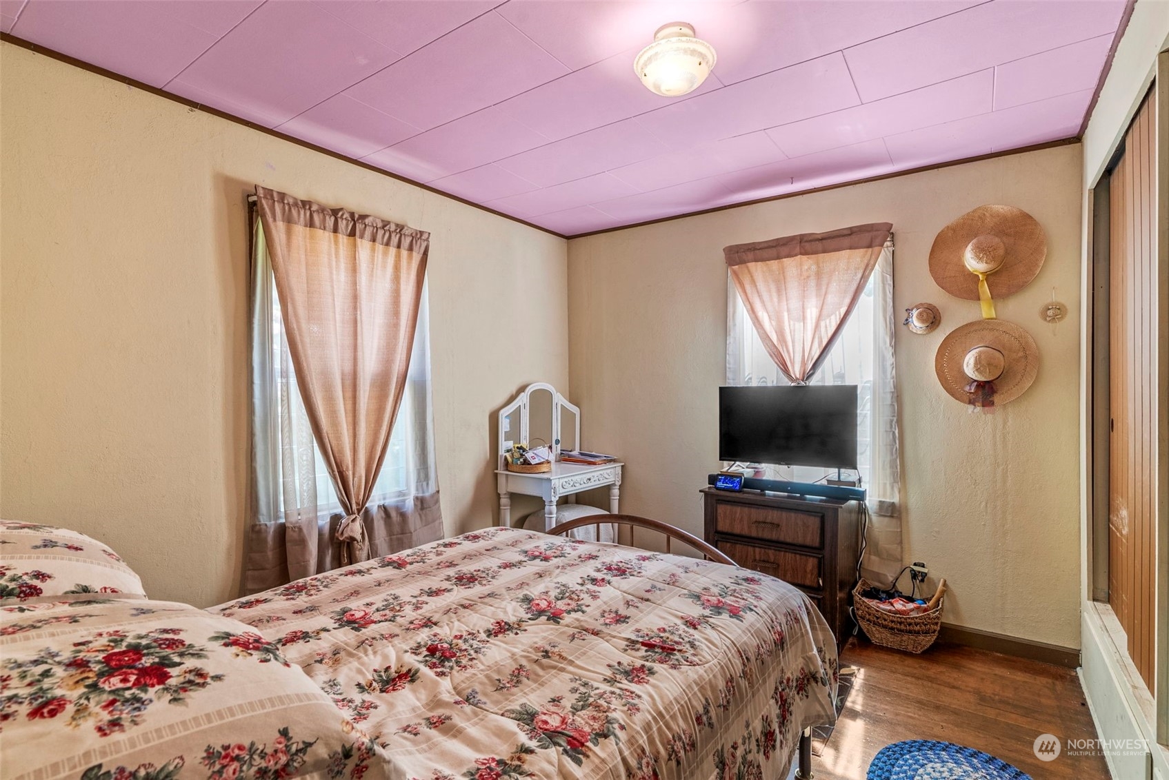 502 Burcham Street Kelso, WA 98626 - Photo 7 of 38 a bedroom with a bed and a flat screen tv