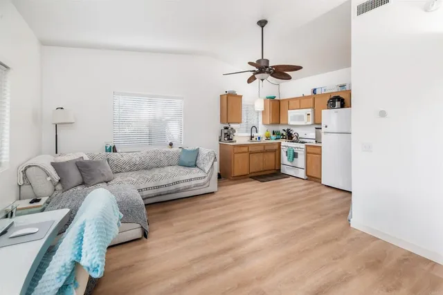 a kitchen with stainless steel appliances cabinets and a window
