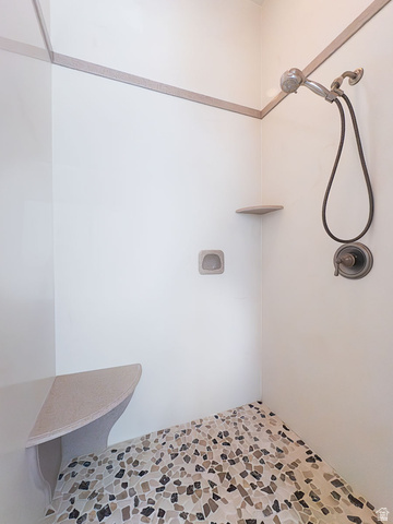 888 East Fiddlers Canyon Road Cedar City, UT 84721 - Photo 33 of 74 Bathroom featuring a tile shower and light stone finish floors