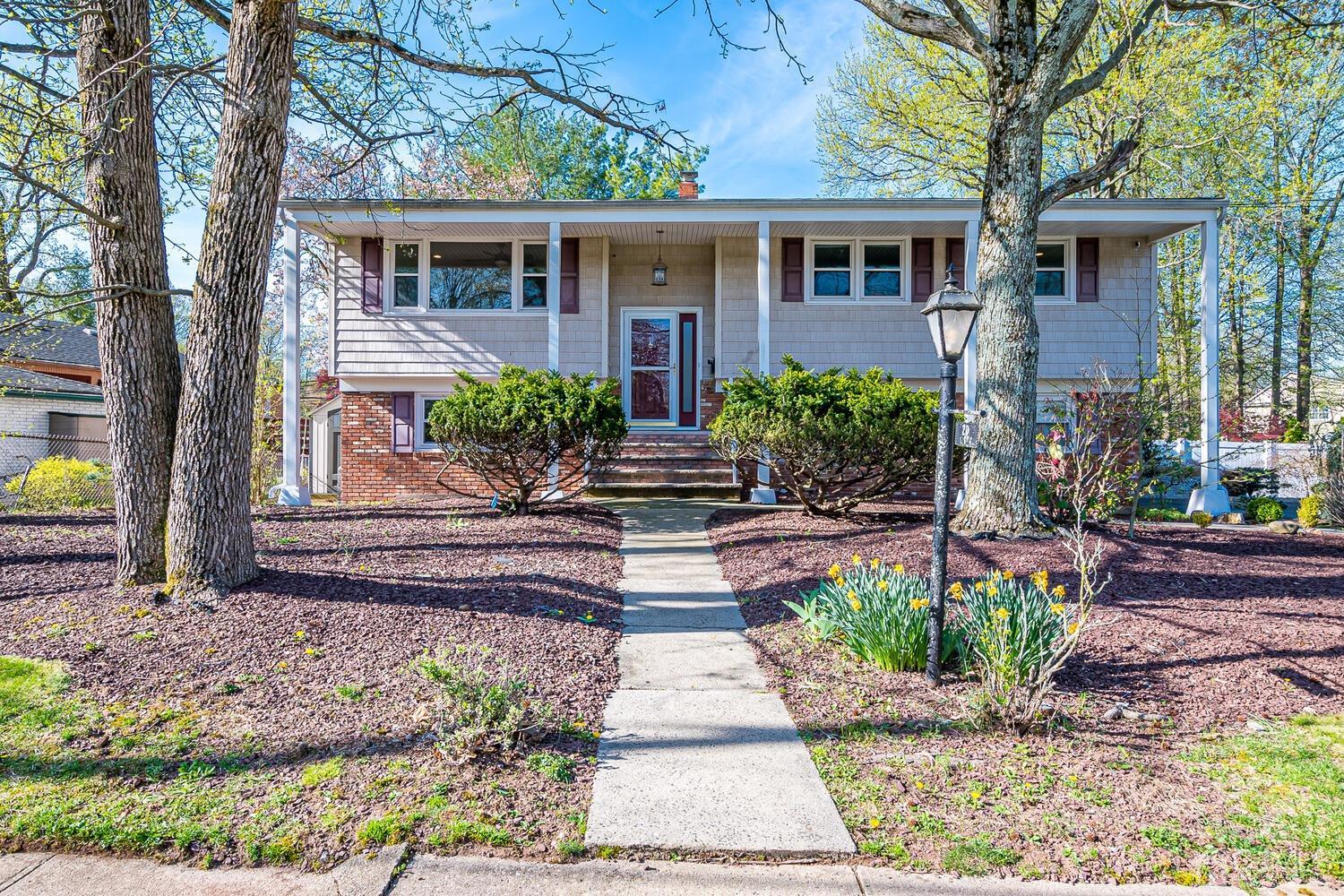 a front view of a house with garden