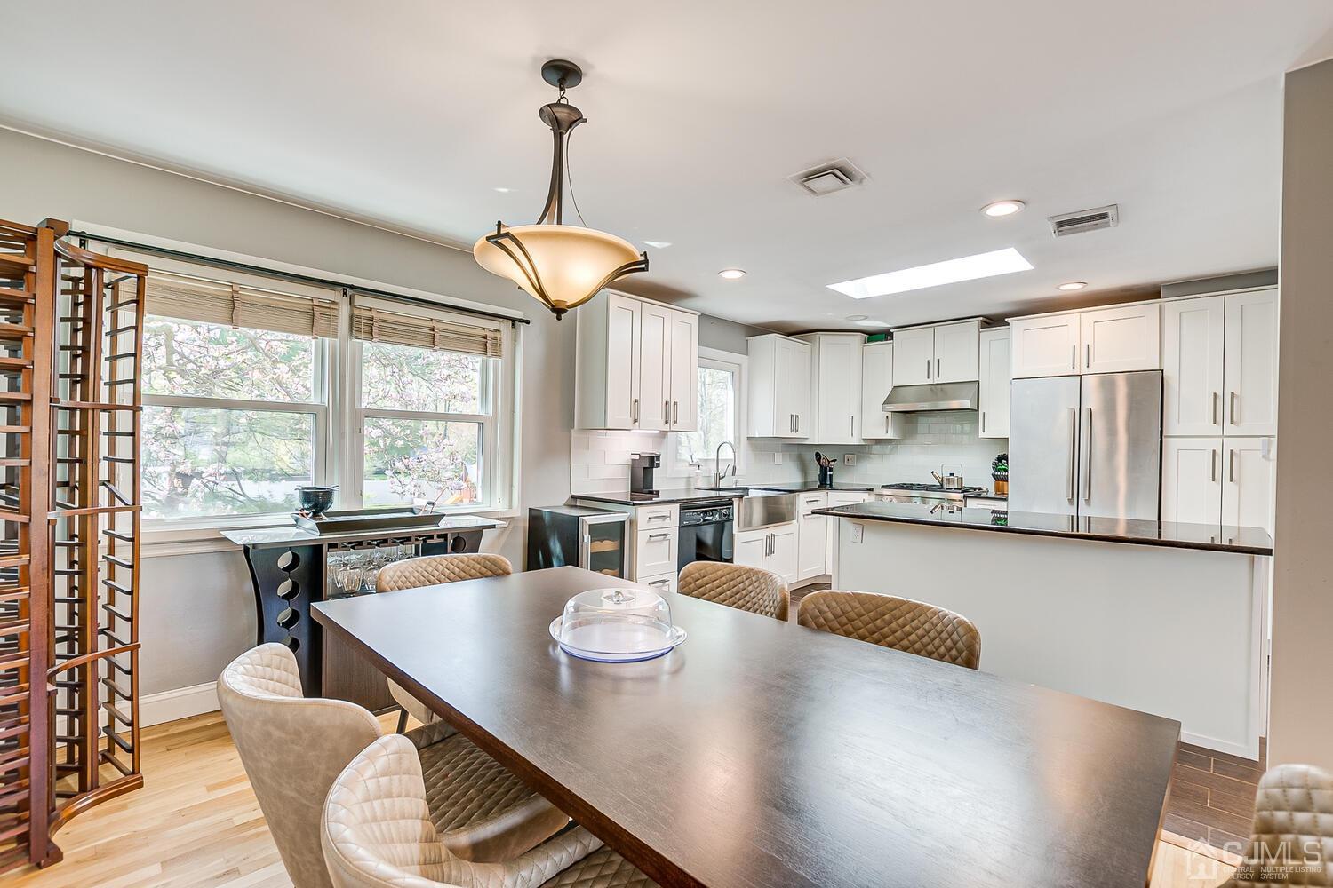 20 Homestead Road Metuchen, NJ 08840 - Photo 16 of 49 a open dining room with stainless steel appliances furniture a window and kitchen view