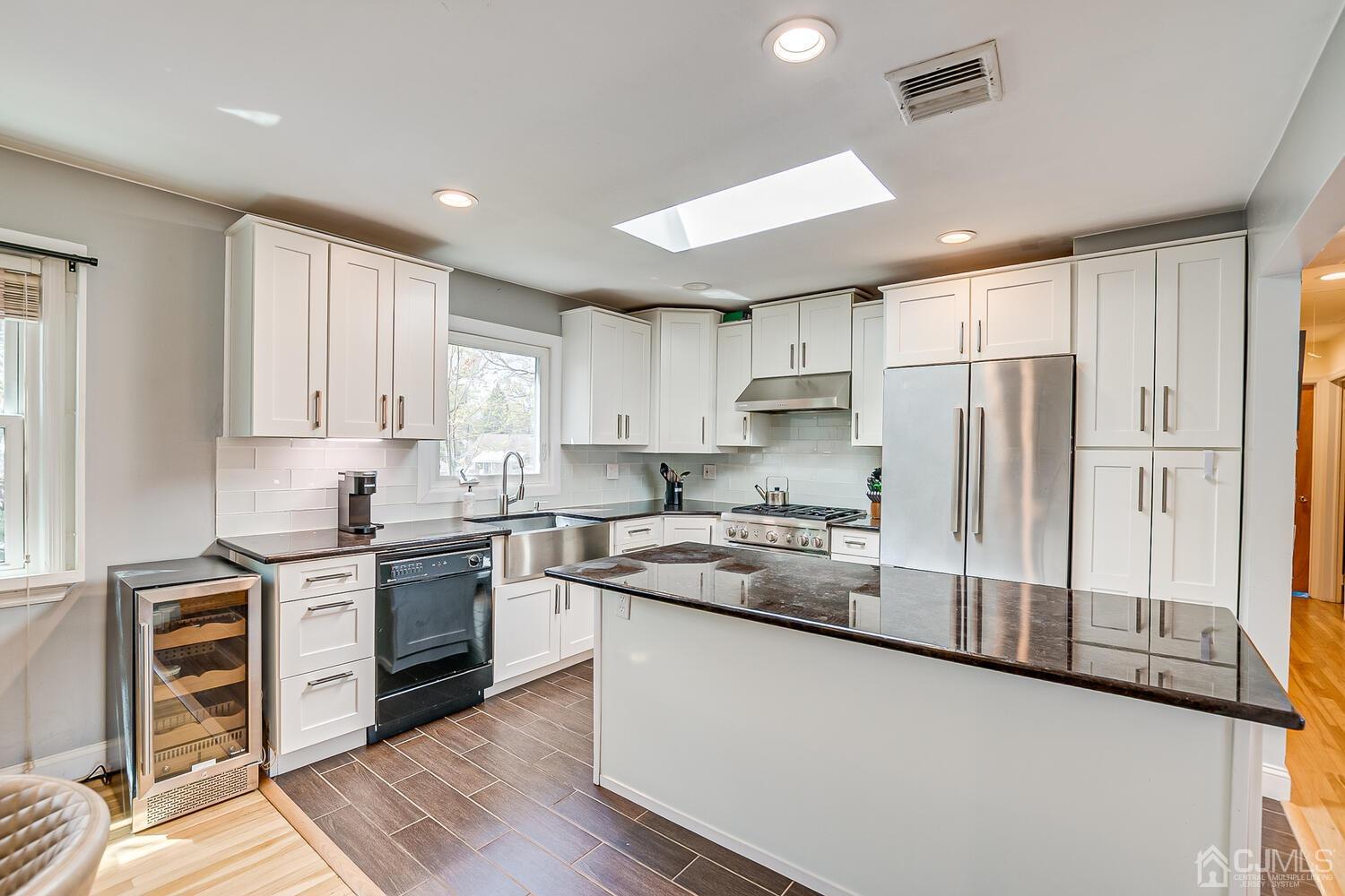 20 Homestead Road Metuchen, NJ 08840 - Photo 19 of 49 a kitchen with stainless steel appliances granite countertop a stove a sink and a refrigerator