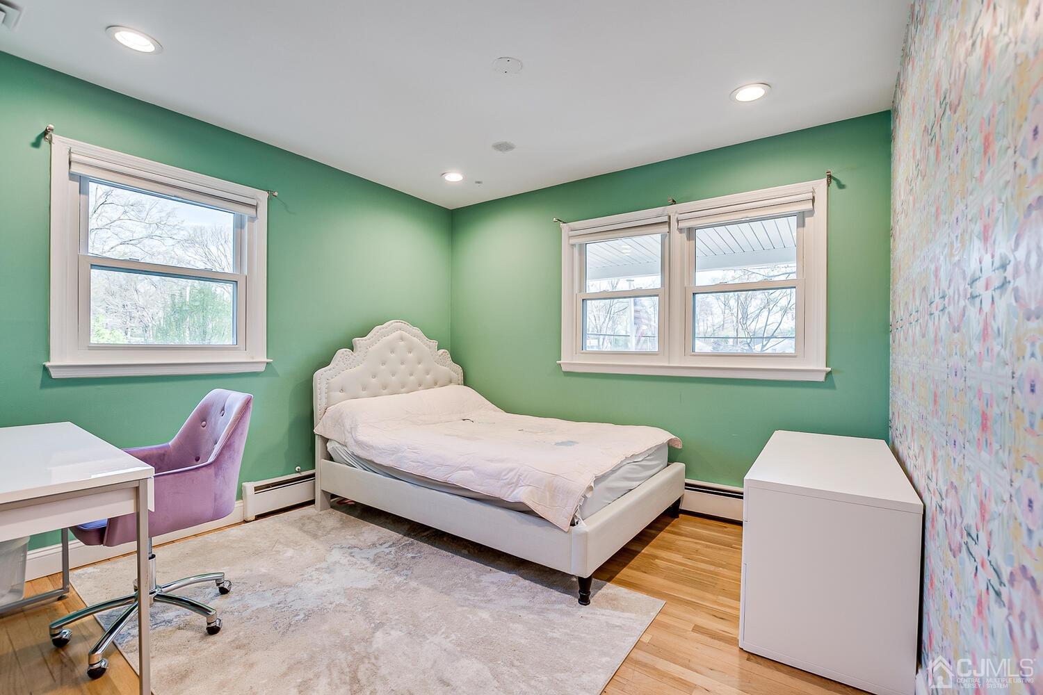 20 Homestead Road Metuchen, NJ 08840 - Photo 26 of 49 a bedroom with a bed and a chair