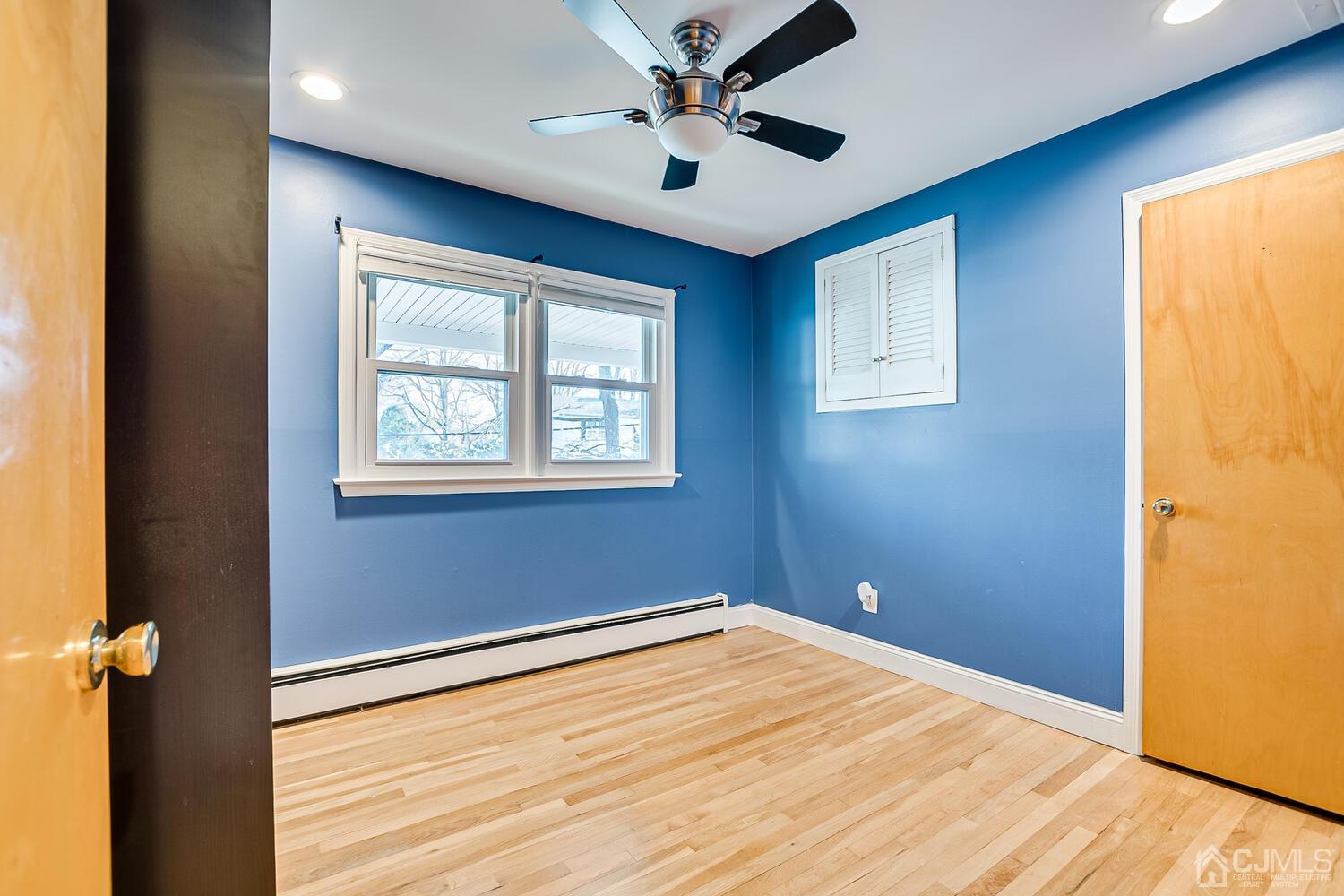 20 Homestead Road Metuchen, NJ 08840 - Photo 28 of 49 a view of empty room with wooden floor and fan