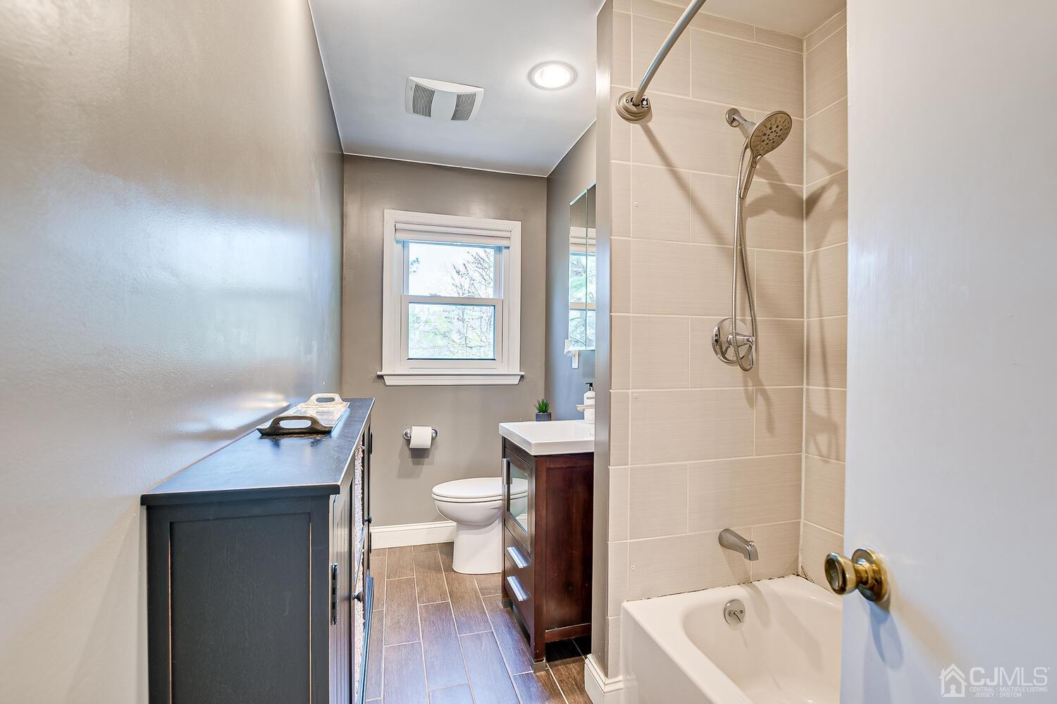 20 Homestead Road Metuchen, NJ 08840 - Photo 29 of 49 a bathroom with a sink a toilet and bathtub