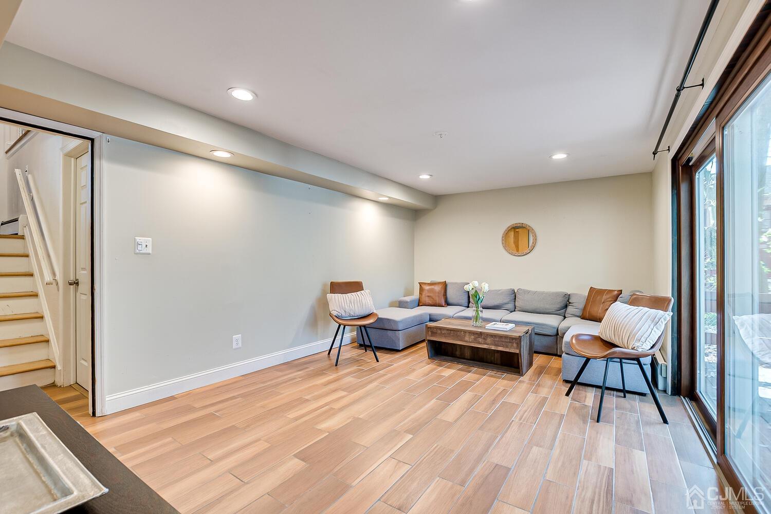 20 Homestead Road Metuchen, NJ 08840 - Photo 31 of 49 a living room with furniture and a wooden floor