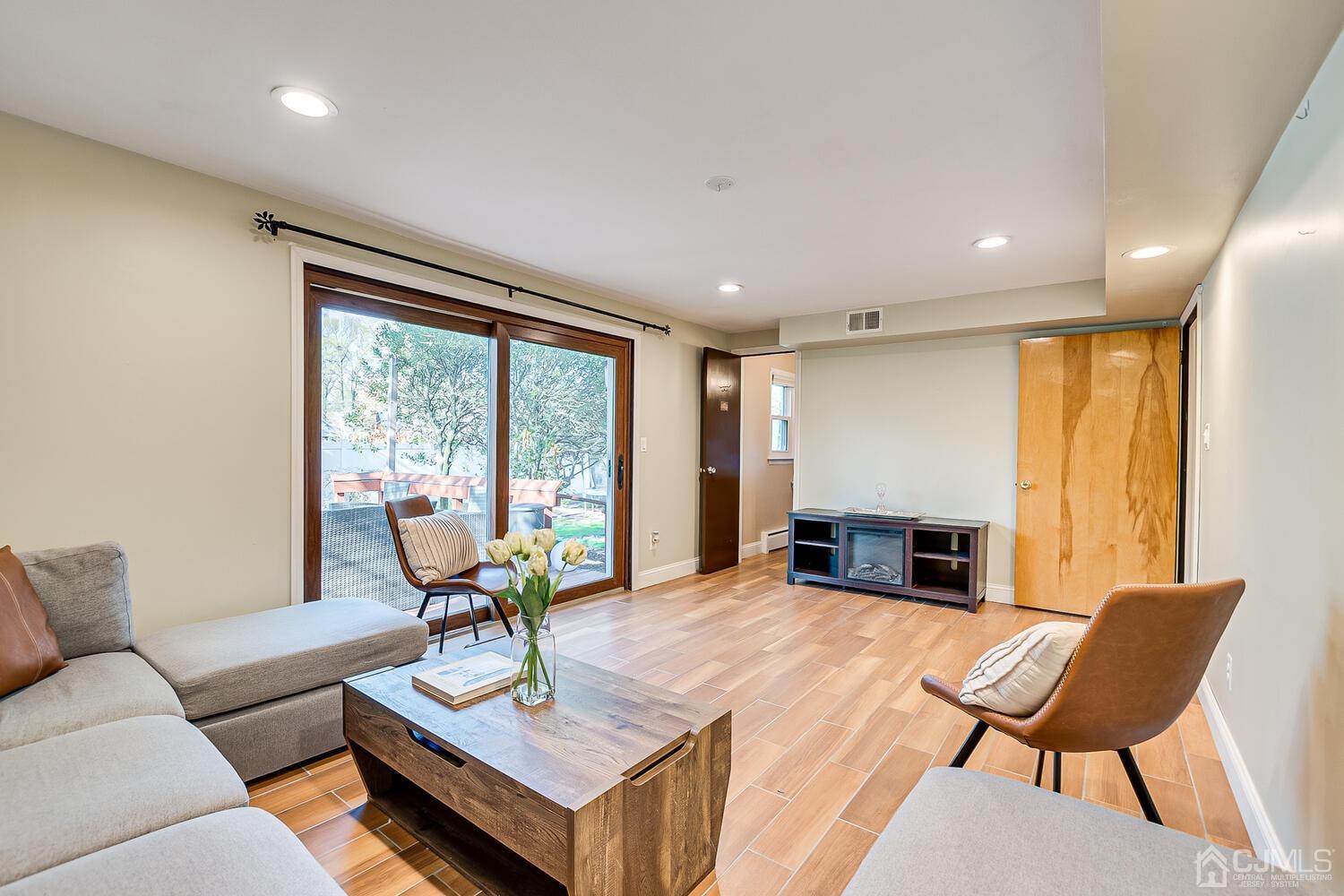 20 Homestead Road Metuchen, NJ 08840 - Photo 32 of 49 a living room with furniture and a large window