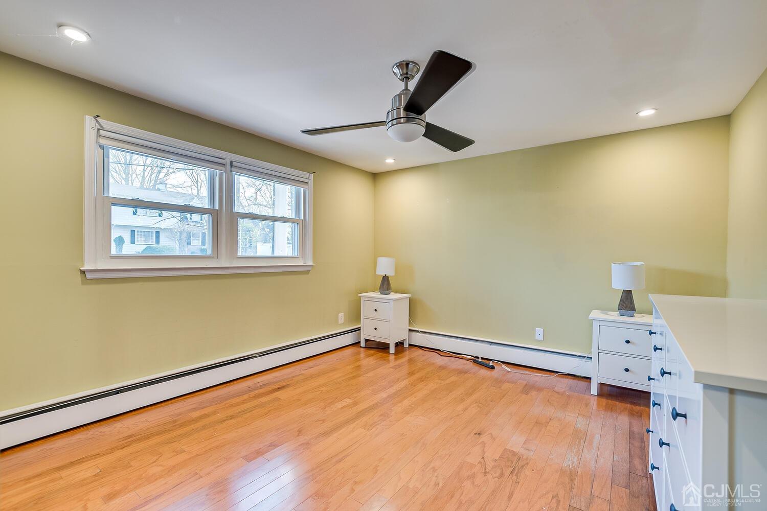 20 Homestead Road Metuchen, NJ 08840 - Photo 34 of 49 a bedroom with a bed and a window