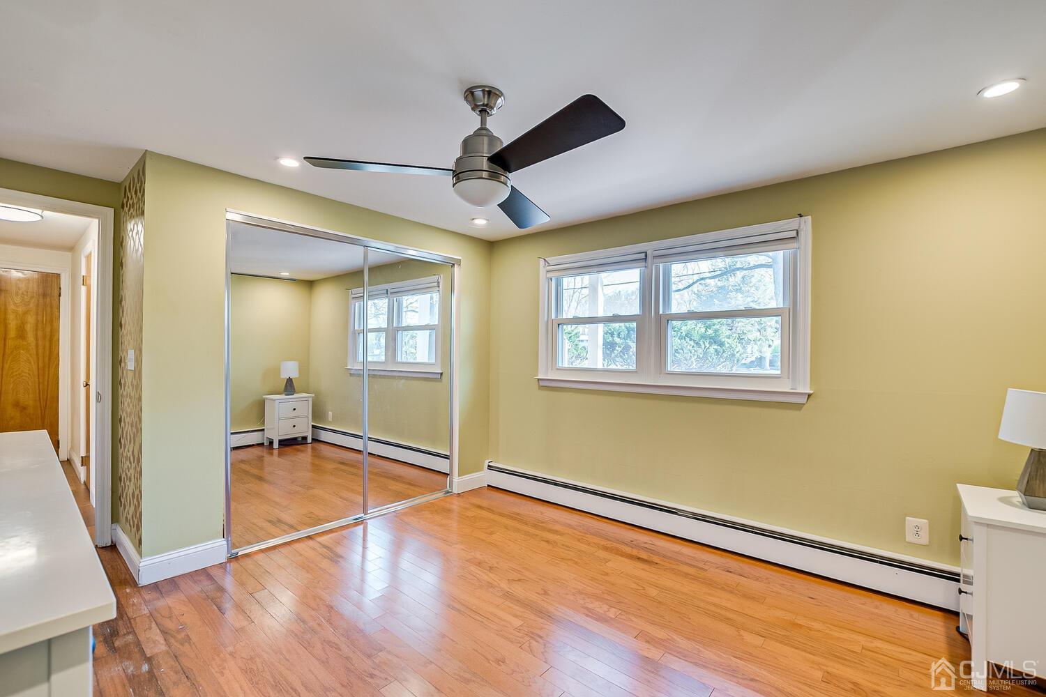 20 Homestead Road Metuchen, NJ 08840 - Photo 35 of 49 a view of an empty room with wooden floor and a window