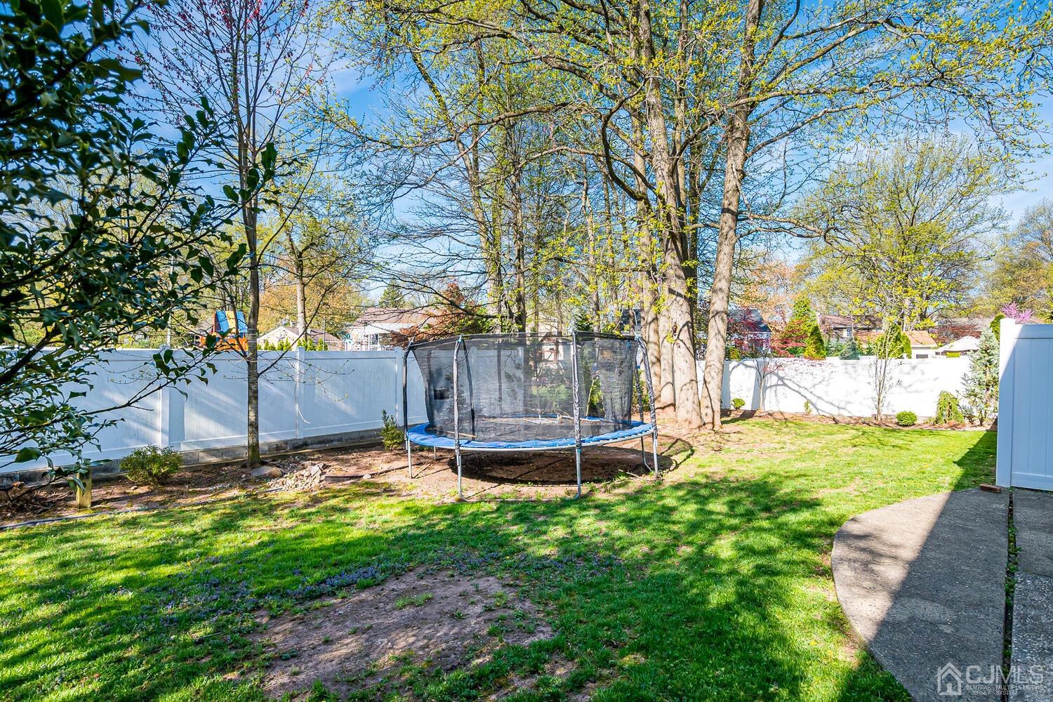 20 Homestead Road Metuchen, NJ 08840 - Photo 42 of 49 a view of a backyard with large trees