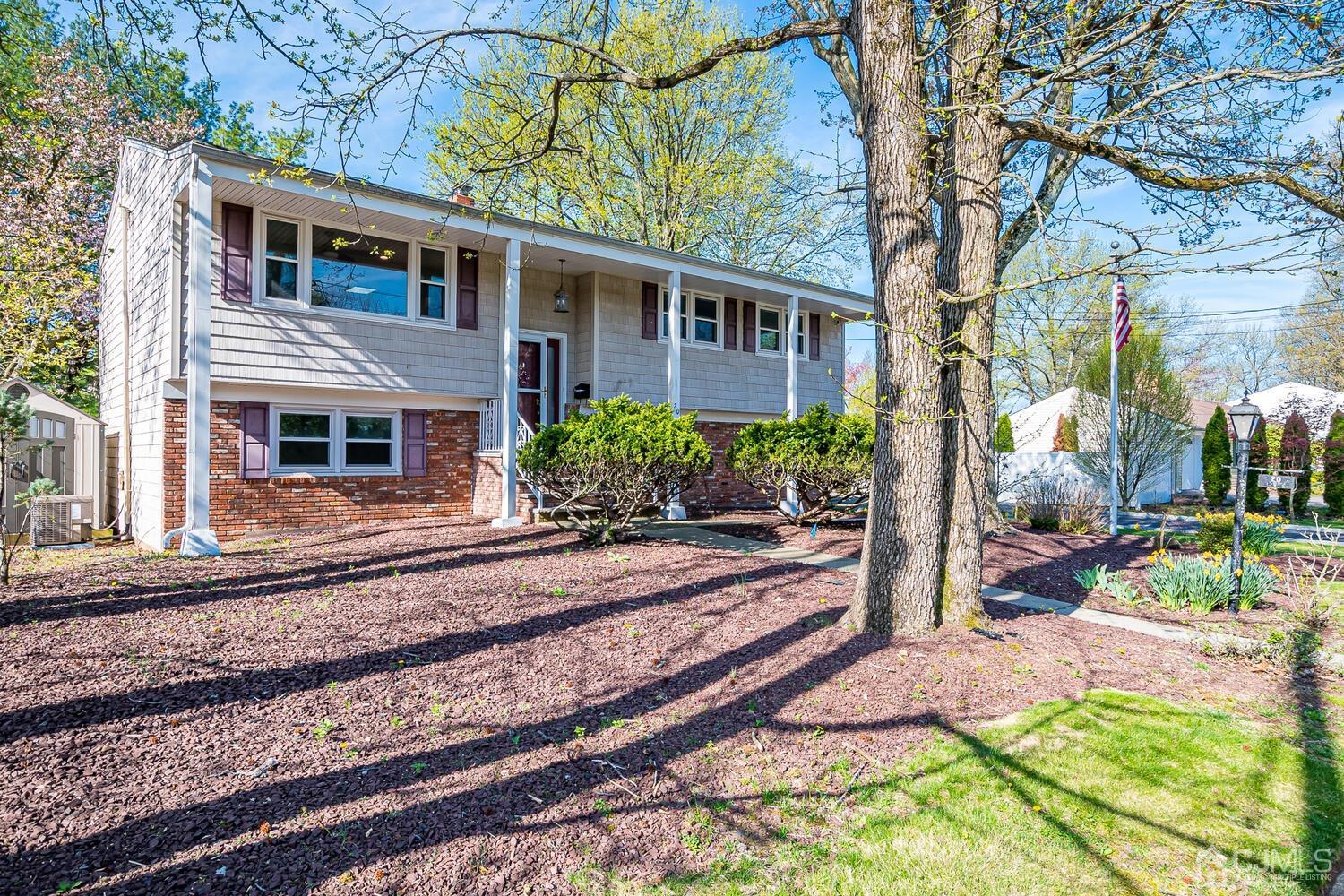 20 Homestead Road Metuchen, NJ 08840 - Photo 7 of 49 a front view of a house with garden