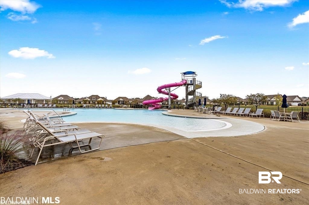 23810 Unbridled Loop Daphne, AL 36526 - Photo 49 of 50 View of swimming pool featuring a water slide and a patio area