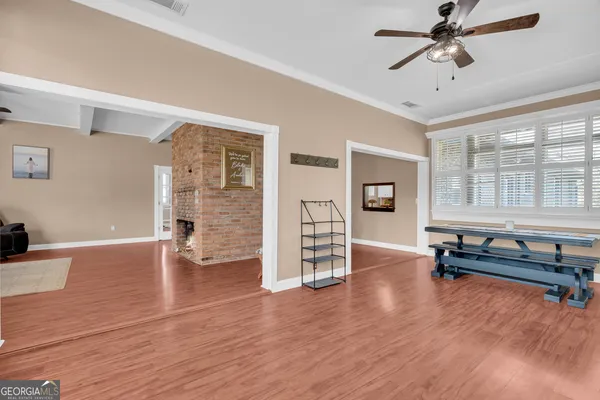 a bedroom with a bed and a chair