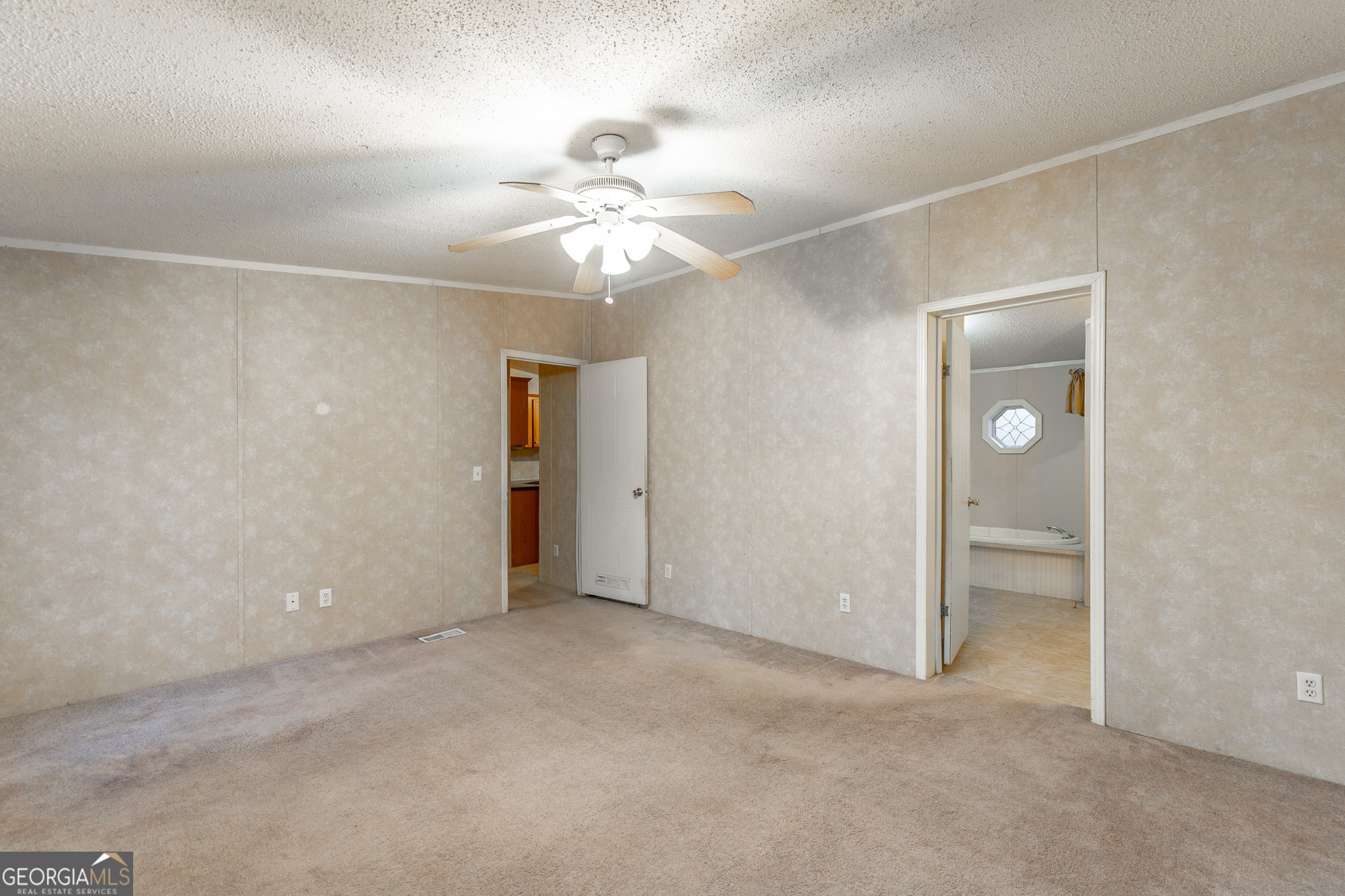 132 Short Hollow Road Trion, GA 30753 - Photo 21 of 46 an empty room with closet and a ceiling fan