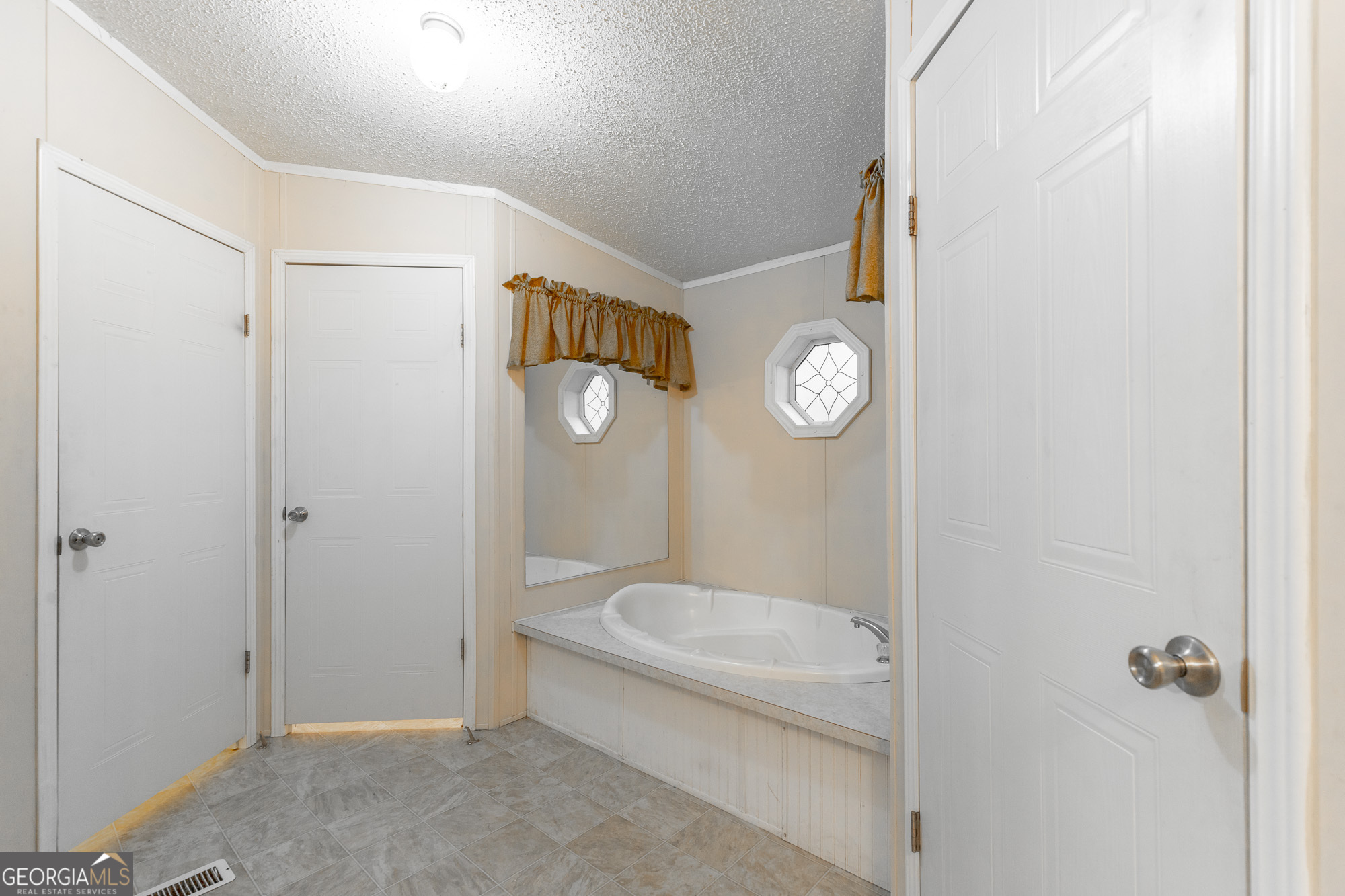 132 Short Hollow Road Trion, GA 30753 - Photo 24 of 46 a bathroom with a toilet a sink and mirror
