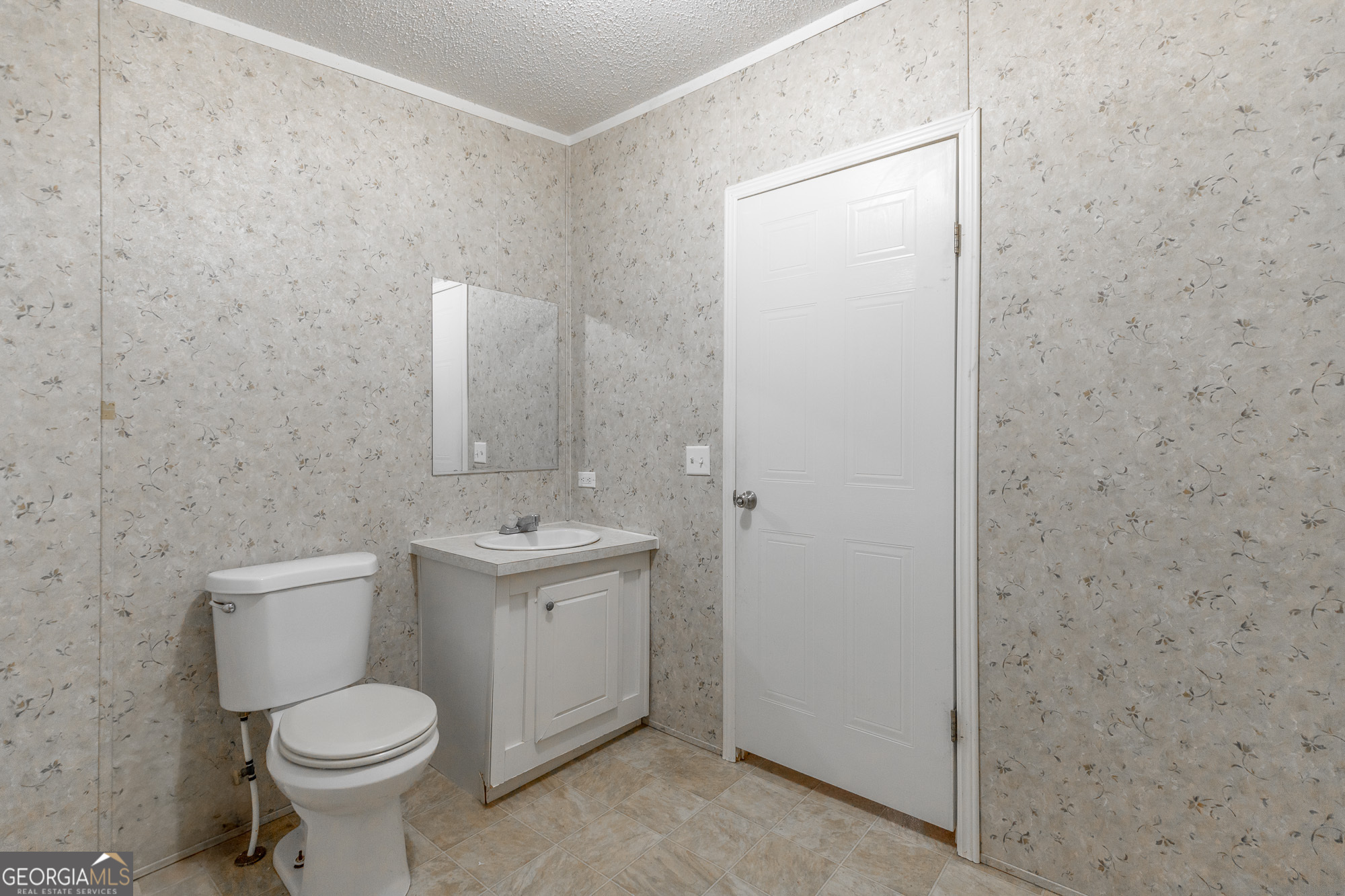 132 Short Hollow Road Trion, GA 30753 - Photo 29 of 46 a bathroom with a sink a toilet and mirror
