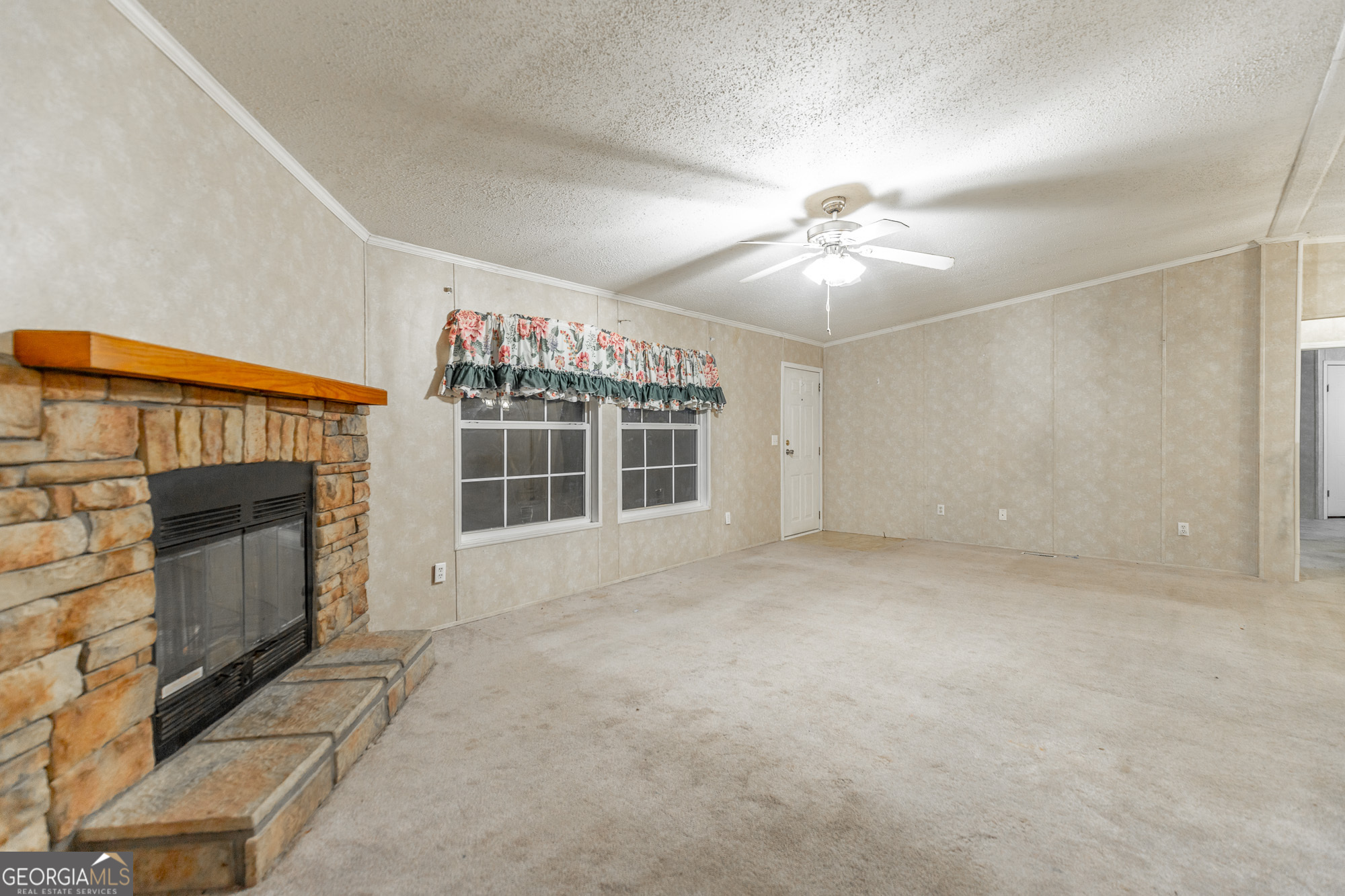 132 Short Hollow Road Trion, GA 30753 - Photo 9 of 46 a view of an empty room with a fireplace