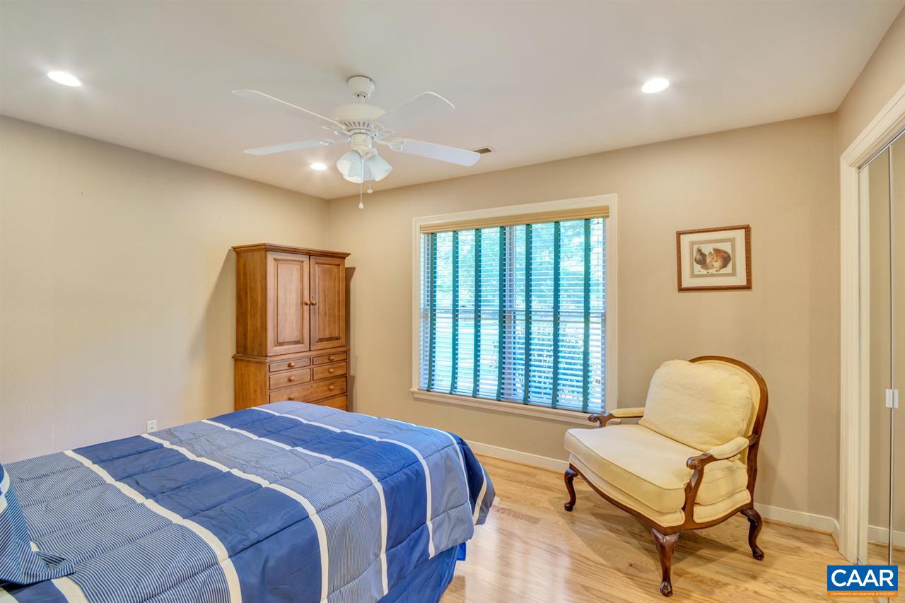 255 Rivanwood Place Charlottesville, VA 22901 - Photo 18 of 25 a bedroom with a bed chair and window