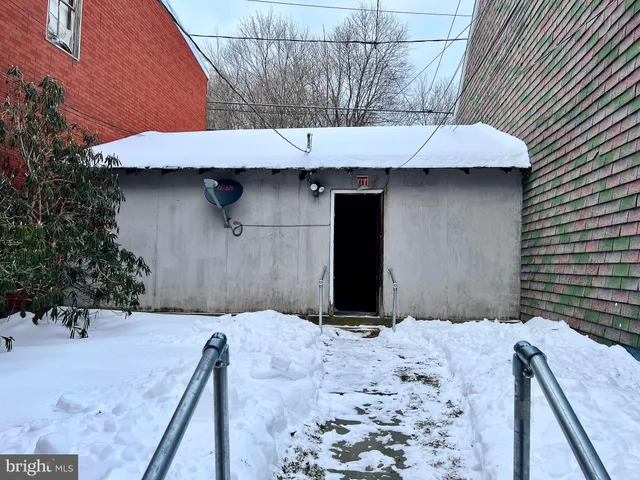 a backyard of a house with a yard and seating space