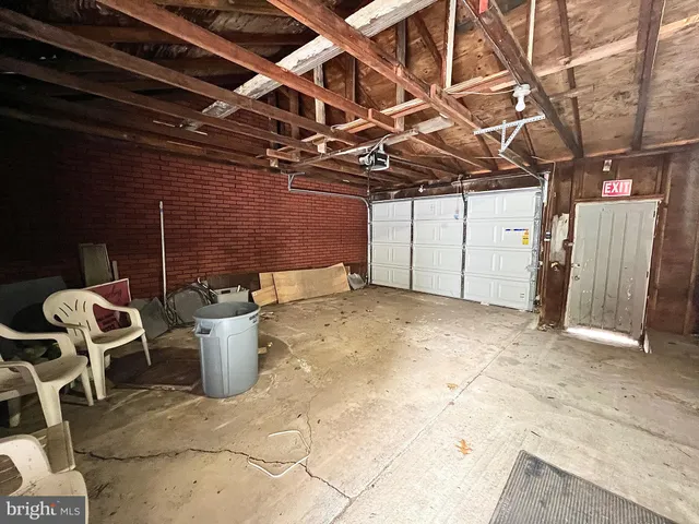 a view of a patio with table and chairs