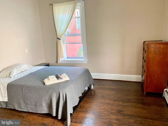 view of a room with wooden floor and windows