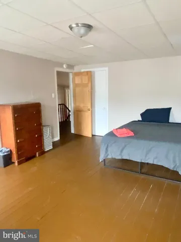 a bedroom with a bed and cabinets