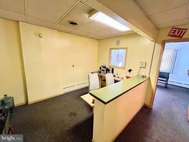 a view of a storage & utility room with two washing machine