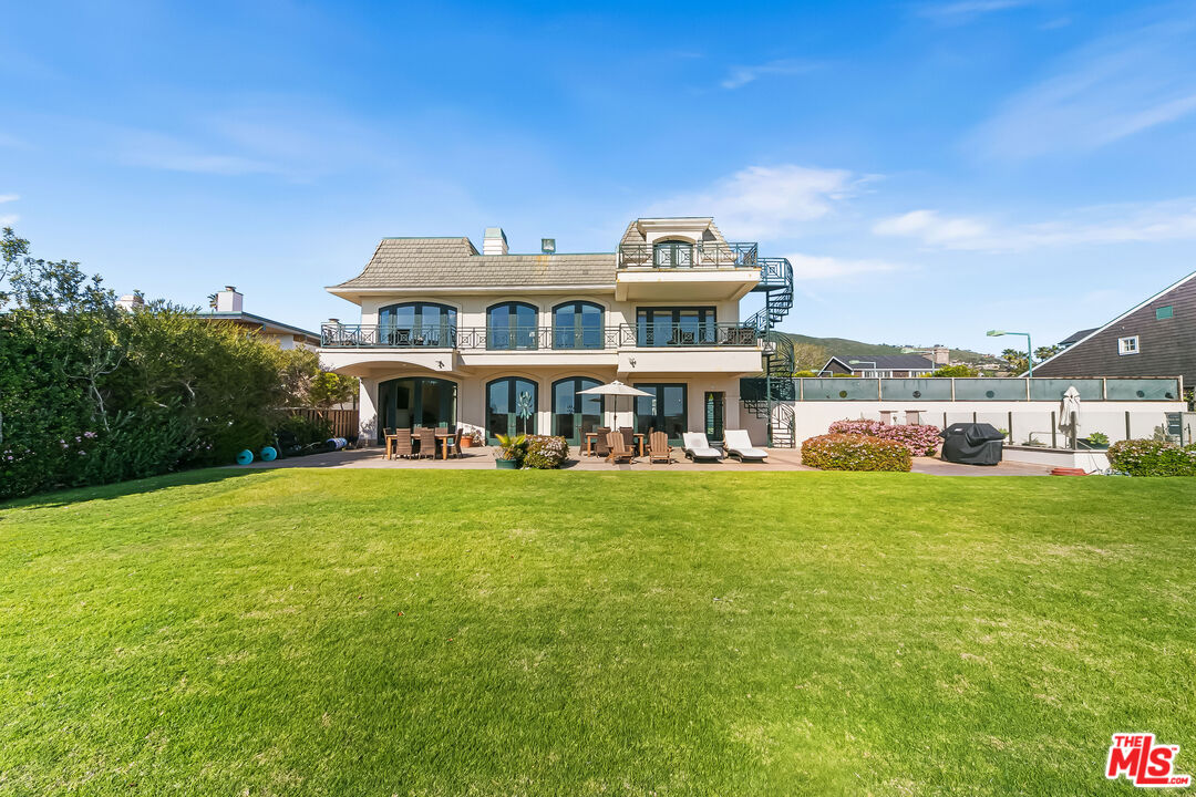 0 Broad Beach Road Malibu, CA 90265 - Photo 27 of 54 a front view of a house with a garden